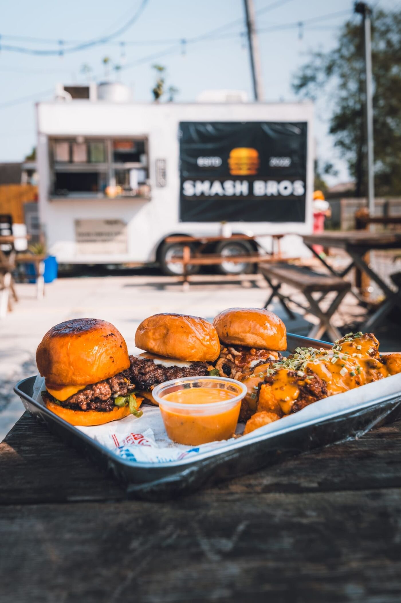Smash Bros 956 food truck with loaded sliders and chicken bites tray